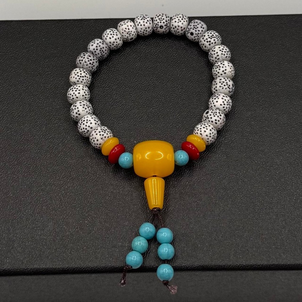 Unique beads with black spots bracelet with turquoise and red accent beads